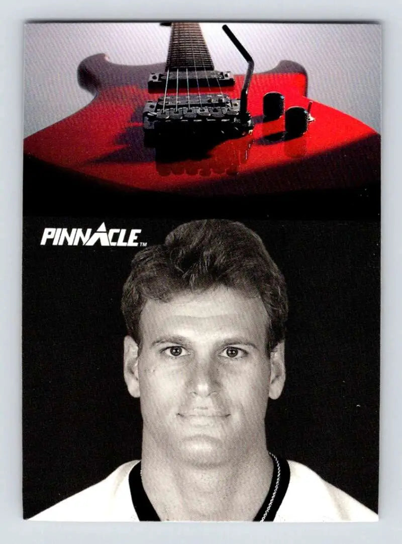 Red electric guitar with black hardware, featured alongside Gary Nylund Hockey Card