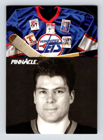 Winnipeg Jets hockey jersey, Pat Elynuik trading cards, and hockey stick above card