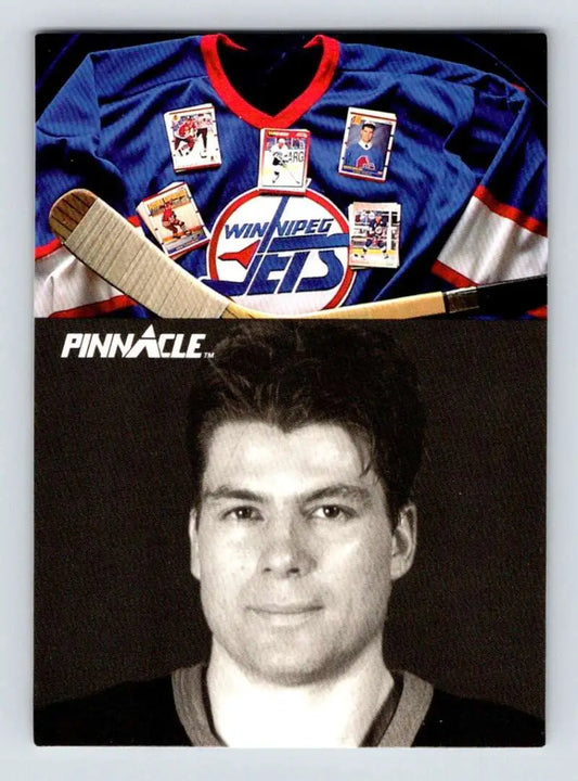 Winnipeg Jets hockey jersey, Pat Elynuik trading cards, and hockey stick above card