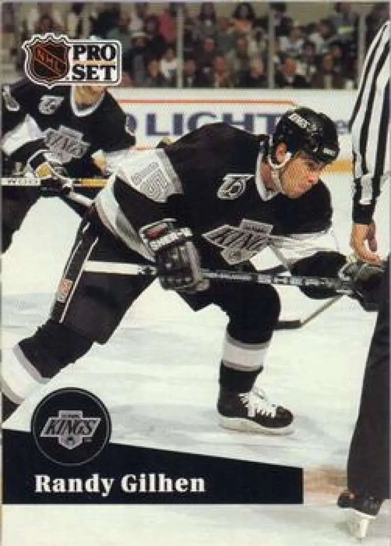 Hockey player Randy Gilhen in Los Angeles Kings uniform during face-off action