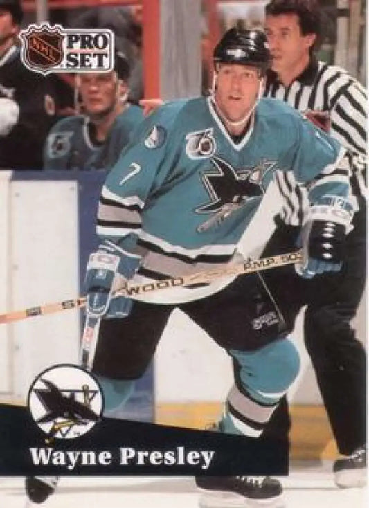 NHL Pro Set hockey card of Wayne Presley in teal San Jose Sharks jersey during gameplay