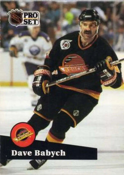 NHL Pro Set hockey card of Dave Babych in black uniform for Vancouver Canucks hockey
