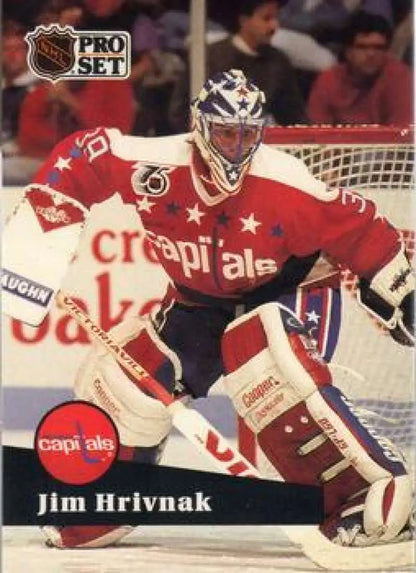 Hockey goalie Jim Hrivnak in red Washington Capitals jersey making a save for Pro Set