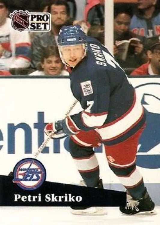 Hockey player in dark blue and red Winnipeg Jets uniform for Petri Skriko Pro Set card