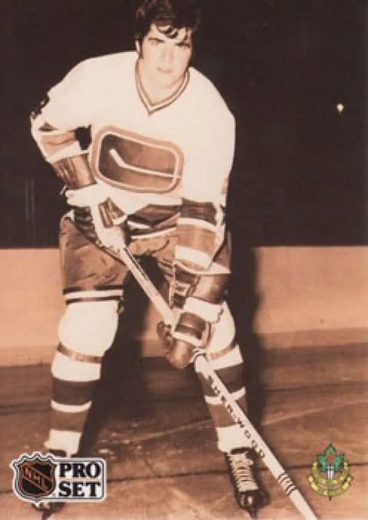 Vintage sepia-toned photograph of Dale Tallon in Vancouver Canucks uniform for hockey card