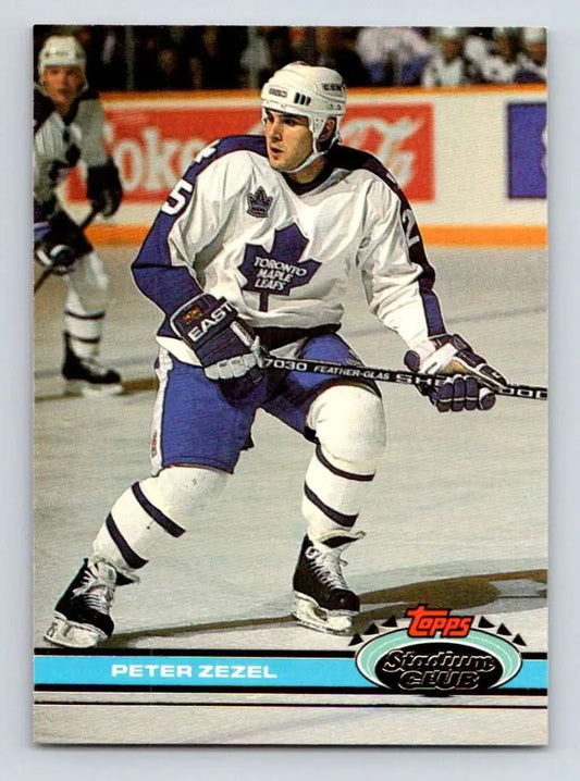Hockey player in Toronto Maple Leafs uniform skating with stick on Peter Zezel card
