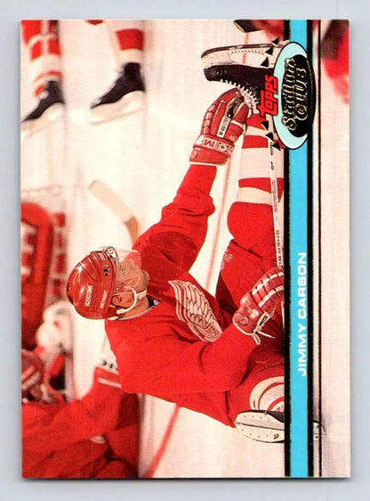 Hockey player in red uniform celebrating against boards on Detroit Red Wings card