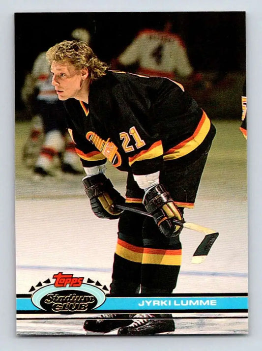 Hockey player in black and yellow Vancouver Canucks jersey, Topps Stadium Club card image