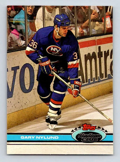 Hockey player in New York Islanders #36 jersey skating, featuring Gary Nylund Topps Stadium Club card