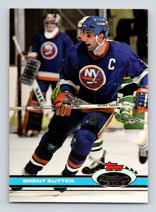 Hockey player in New York Islanders jersey with captain C, showcasing Brent Sutter action
