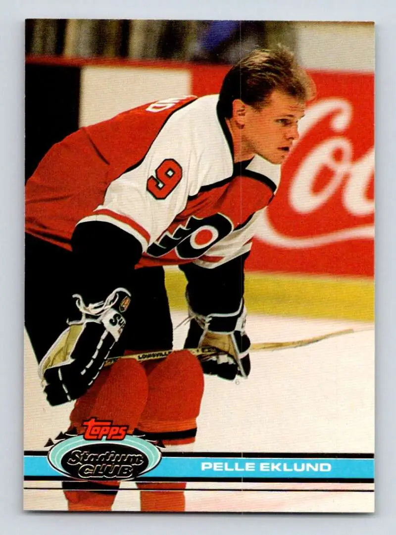 Hockey player in Philadelphia Flyers jersey skates, featured in Pelle Eklund Stadium Club card