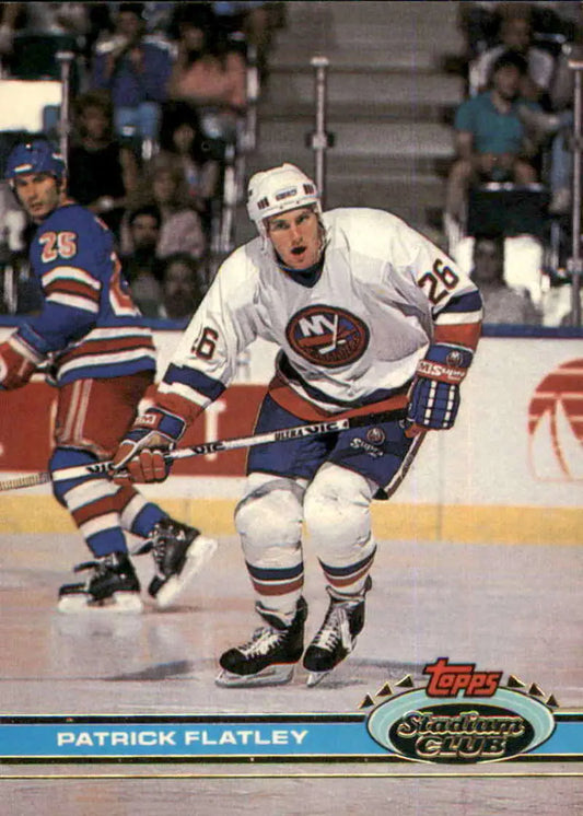 Hockey player in New York Islanders jersey skating, showcasing Pat Flatley Topps Stadium Club card