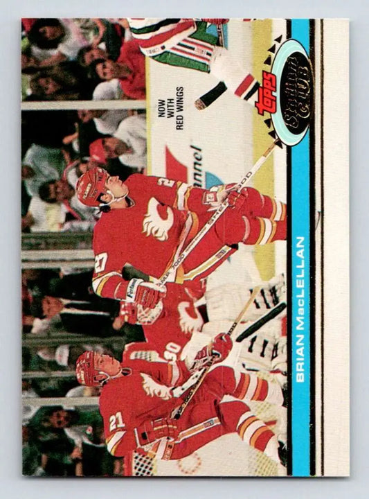 Hockey trading card featuring Detroit Red Wings players celebrating on ice