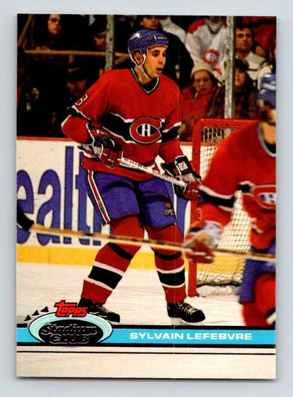 Hockey player in Montreal Canadiens jersey showcasing Sylvain Lefebvre Topps Stadium Club card
