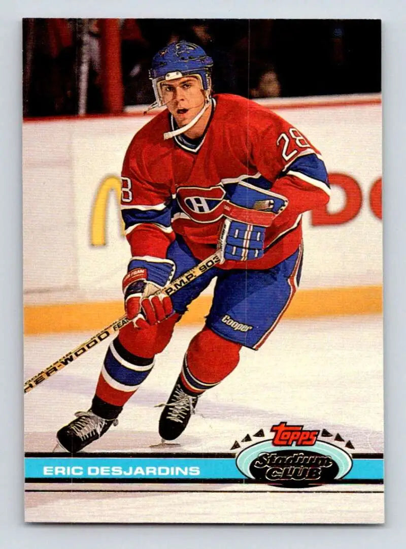 Hockey player in Montreal Canadiens uniform skates with stick on Topps Stadium Club card