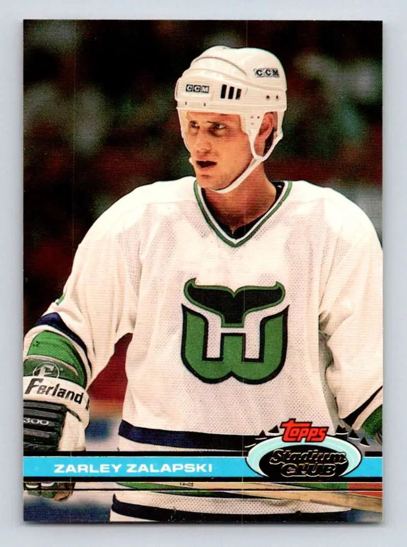 Hockey player in Hartford Whalers jersey showcases Zarley Zalapski Topps Stadium Club card