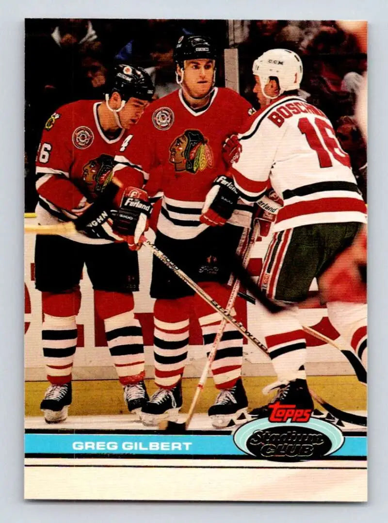 Hockey card of Greg Gilbert with Chicago Blackhawks in red and white jerseys