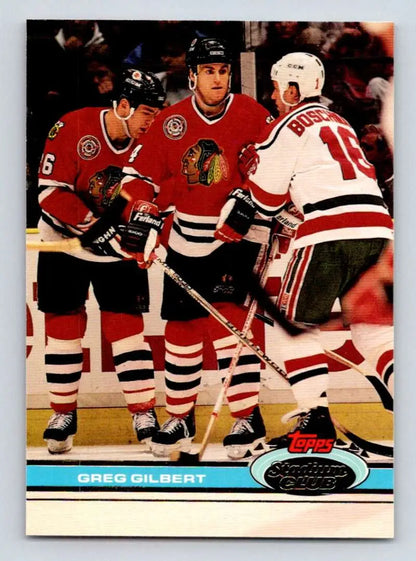 Hockey card of Greg Gilbert with Chicago Blackhawks in red and white jerseys