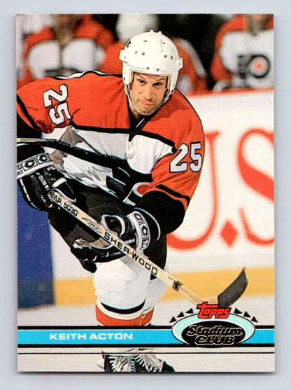 Hockey player in red #25 Philadelphia Flyers jersey showcasing Keith Acton action shot