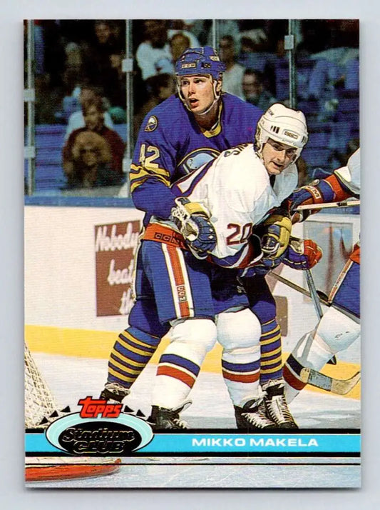 Hockey card depicting Buffalo Sabres players in action from Topps Stadium Club