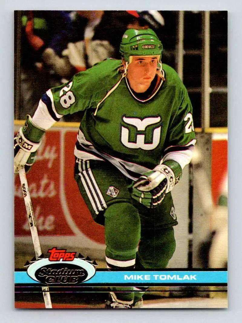 Hockey player in green Hartford Whalers jersey number 28 on Topps Stadium Club hockey card
