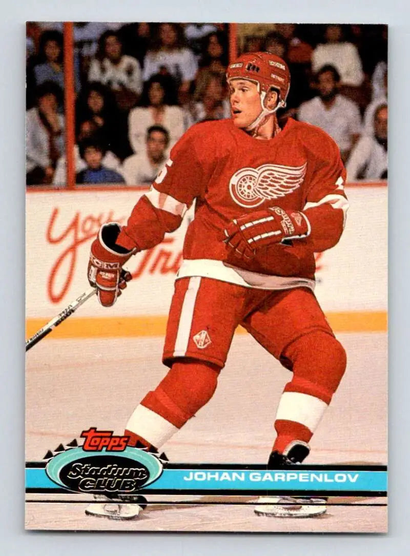 Detroit Red Wings player Johan Garpenlov skating on ice, featured in Stadium Club hockey card