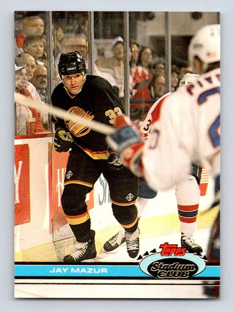 Hockey player in black and yellow Vancouver Canucks uniform, Jay Mazur hockey card