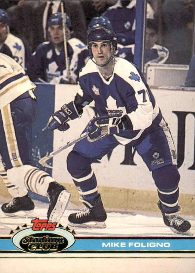 Hockey player in Toronto Maple Leafs jersey representing Mike Foligno in action