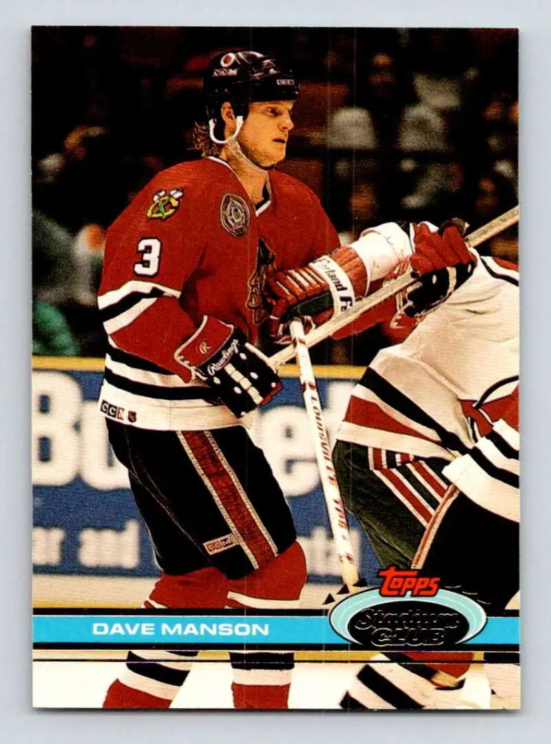 Hockey player in red Chicago Blackhawks jersey, showcasing Dave Manson Topps Stadium Club card