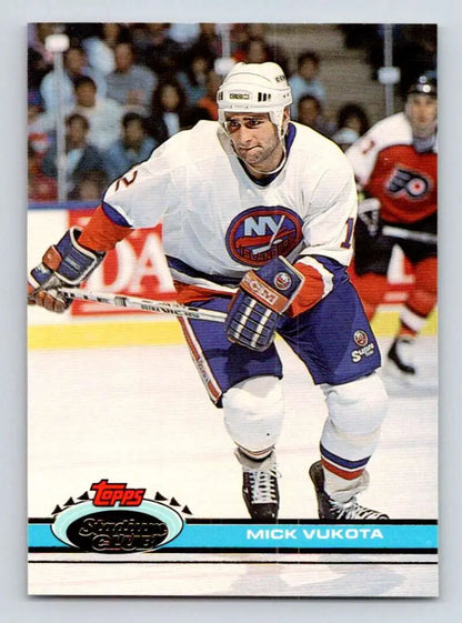 Mick Vukota skating in white jersey on 1991-92 Topps Stadium Club Hockey Card