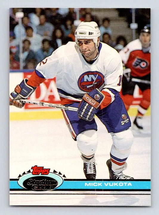 Mick Vukota skating in white jersey on 1991-92 Topps Stadium Club Hockey Card