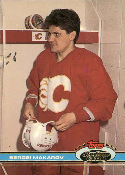 Hockey player in red Calgary Flames jersey with helmet, showcasing Sergei Makarov card