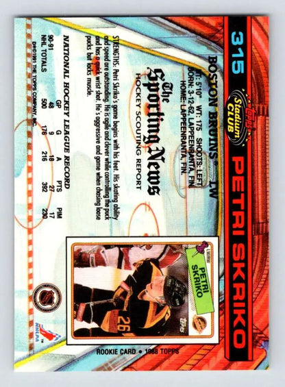 Baseball trading card with orange and blue border design featuring Petri Skriko Boston Bruins