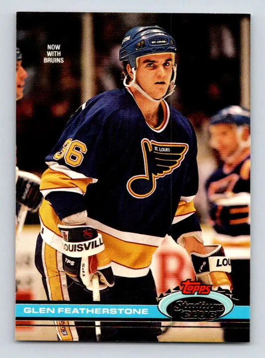 Hockey player in St. Louis Blues jersey 26 featured in Topps Stadium Club card