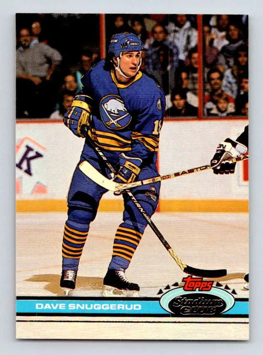 Hockey player in blue and yellow Buffalo Sabres uniform, featuring Dave Snuggerud
