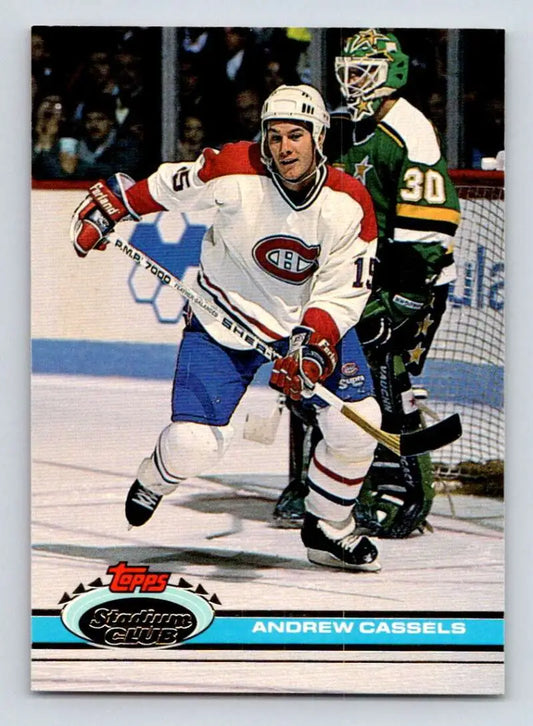 Andrew Cassels skating in white jersey on Montreal Canadiens hockey card against North Stars