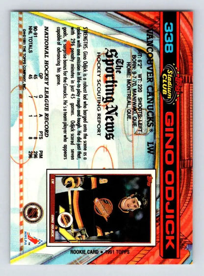 Trading card showcasing Gino Odjick in black and yellow uniform for Vancouver Canucks