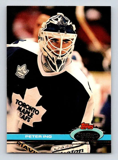 Toronto Maple Leafs goalie Peter Ing in black and white jersey with mask