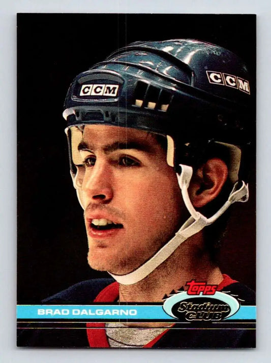 Hockey player in a CCM helmet wearing a dark uniform for Brad Dalgarno New York Islanders hockey card
