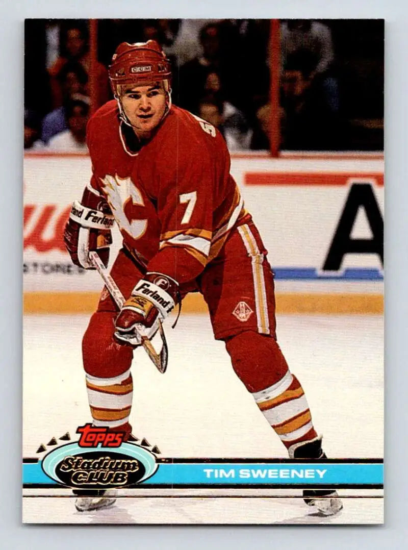 Tim Sweeney in red Calgary Flames jersey number 7 on hockey card from 1991-92 Topps