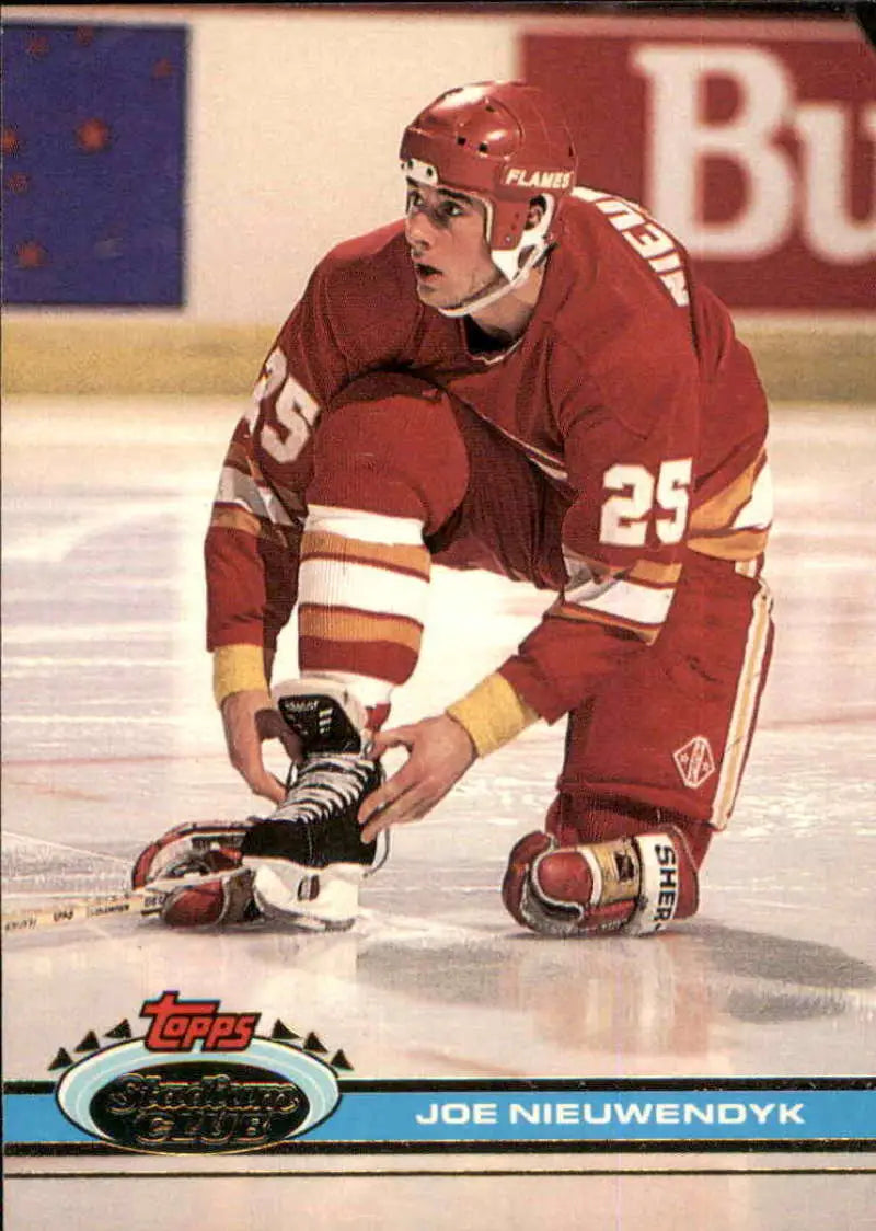 Hockey player Joe Nieuwendyk in red jersey number 25 for Calgary Flames on ice