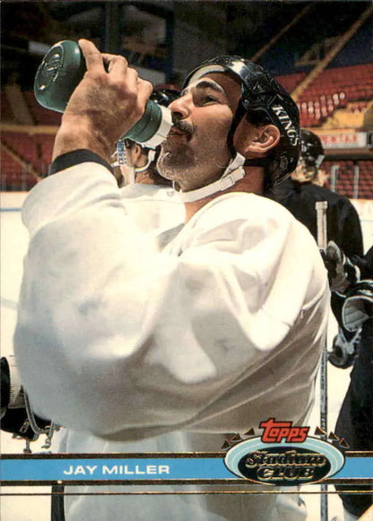 Hockey player in white jersey drinking water, featured in Jay Miller Topps Stadium Club card