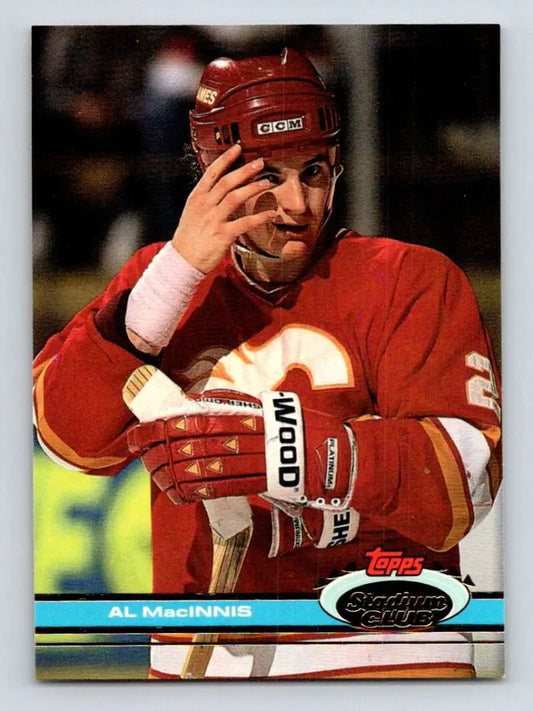 Hockey card of Al MacInnis in red Calgary Flames jersey from Topps Stadium Club