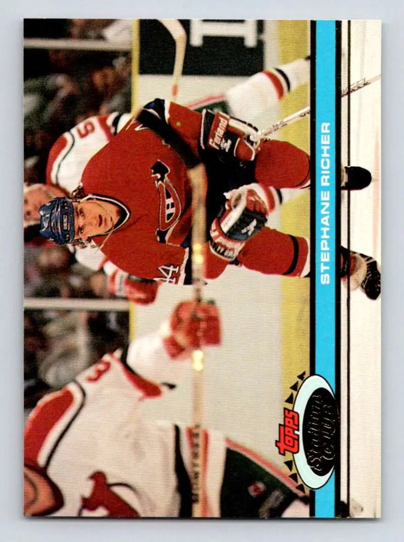 Hockey player in red Carolina Hurricanes jersey on ice for Topps Stadium Club card