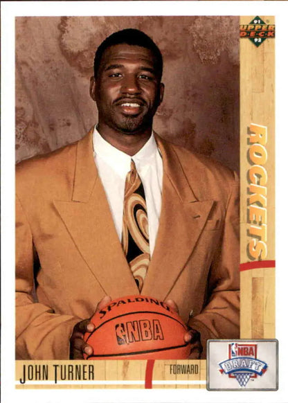John Turner Houston Rockets Basketball Card in a tan suit holding a basketball