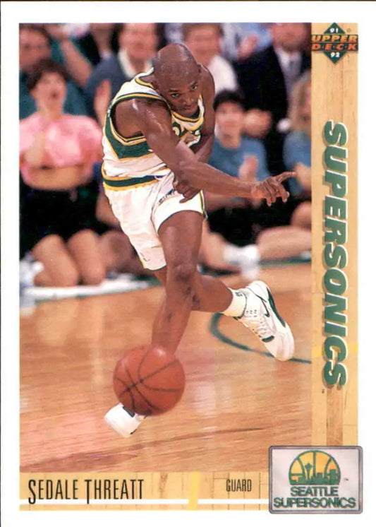Basketball player Sedale Threatt dribbling in Seattle SuperSonics uniform for Upper Deck