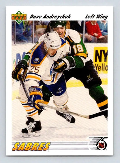 Hockey player in a Buffalo Sabres jersey skating against opponent in dark uniform
