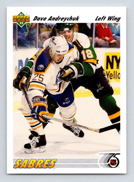 Hockey player in a Buffalo Sabres jersey skating against opponent in dark uniform