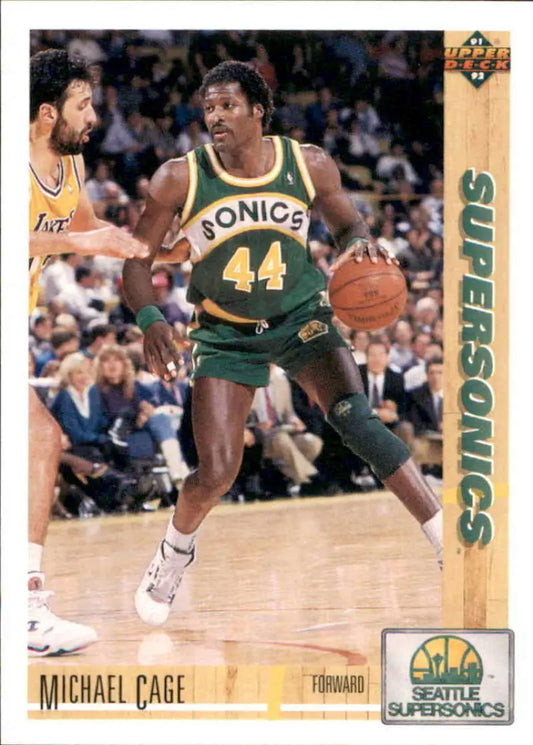 Michael Cage dribbling on 1991-92 Upper Deck #127 Seattle SuperSonics Basketball Card