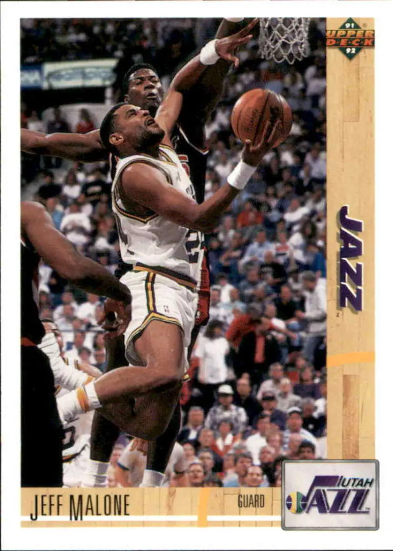 Basketball trading card of Jeff Malone shooting for the Utah Jazz during a game